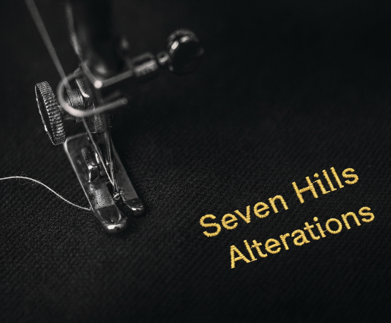 Seven Hills Alteration embroidered on a black garment.